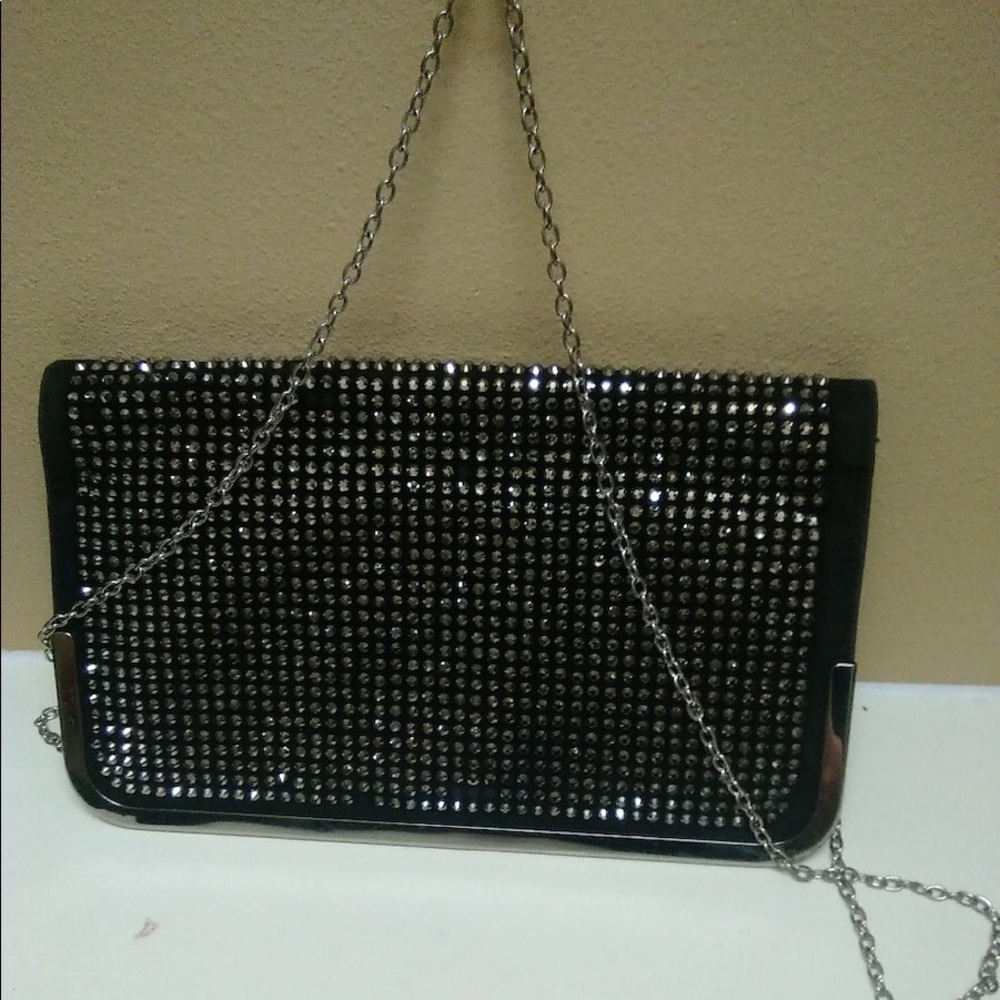 Black clutch with silver studs on the flap
